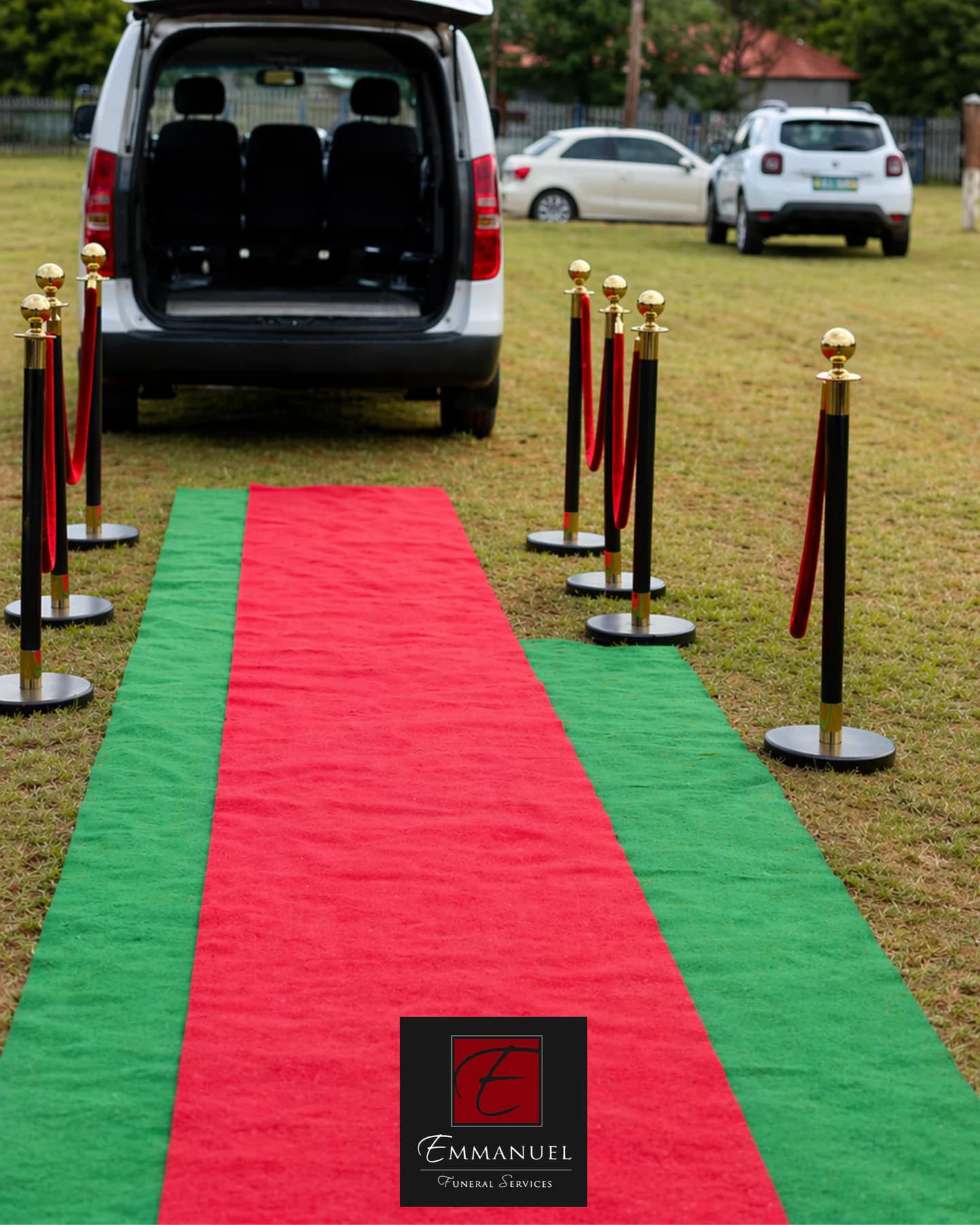 A carpet runner leading to an Emmanuel Funeral Services hearse