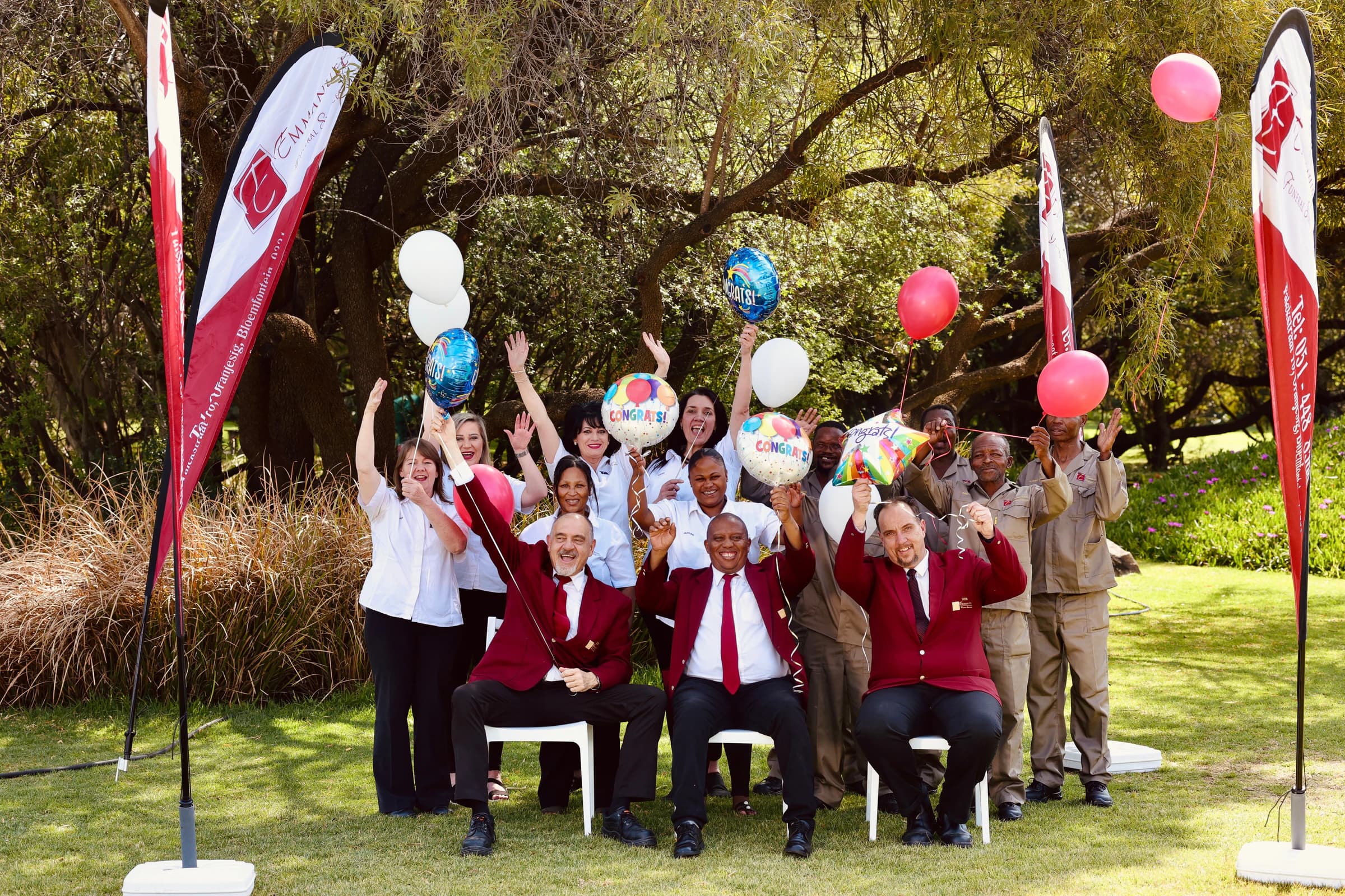 Emmanuel Funeral Services staff celebrating together outdoors