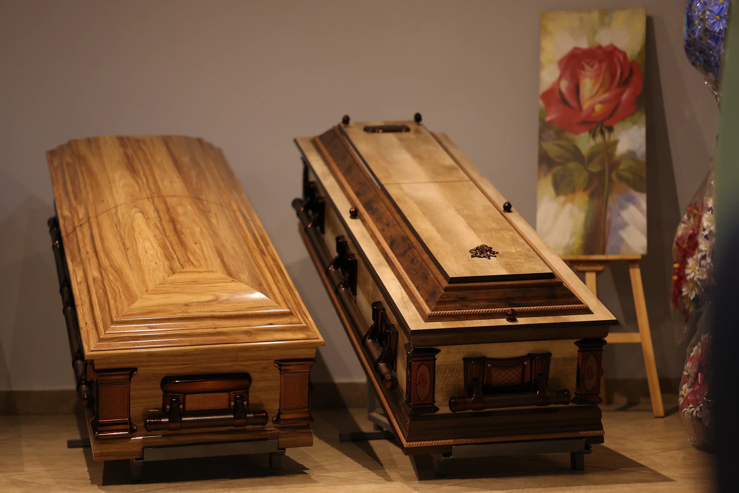 Two wooden coffins on display in the Emmanuel showroom